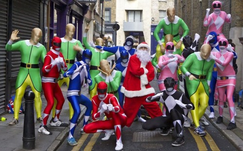 archiemcphee:  Ben Jacobs and Adam Goodall photographed a group of people dressed in Power Rangers morphsuits ambushing the SantaCon in central London in order to “save elves from bad Santas.” “Morphsuits, the all-in-one Lycra bodysuit company,