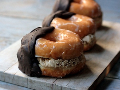 foodpornit:  Glazed donuts stuffed with chocolate chip cookie dough hand dipped in