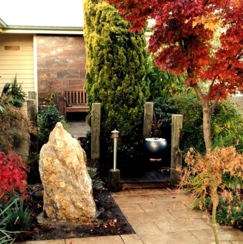 Front Yard - Natural Stone PaversPhoto Of A Large Asian Partial Sun Front Yard Stone Formal Garden.