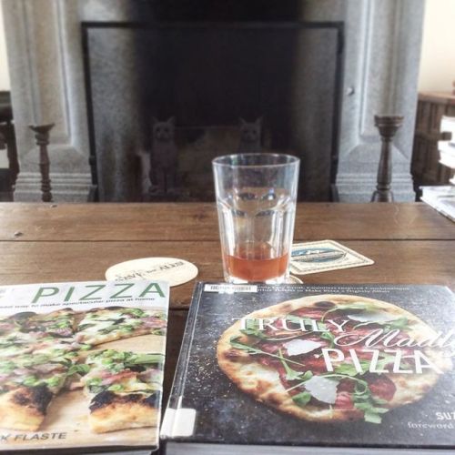 Kurt is outside working on his stone pizza oven. I am inside reading about dough. Later this summer 