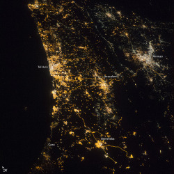 earth-as-art:
“ Eastern Mediterranean Coastline at Night
This night photograph taken by astronauts aboard the International Space Station (ISS) shows the location and size of cities at the east end of the Mediterranean Sea. The largest, brightest...