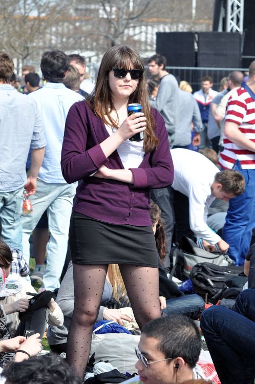 Candid of a woman in black polka dot pantyhose and tight skirt.Woman in pantyhose