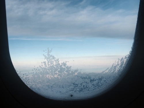 nakedly:you know youre travelling in northern europe when your airplane window looks like this // in