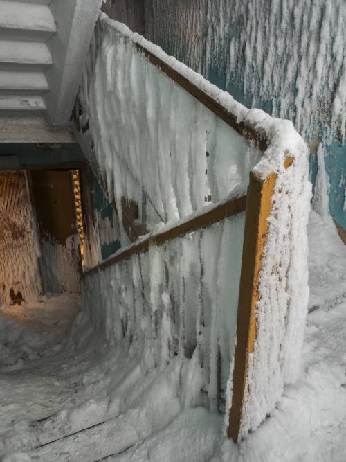 redlipstickresurrected: Maria Passer/Anadolu Agency/ - Vorkuta, Komi Republic, Russia   -   An inside view from snow and ice covered abandoned building in Severny region in Komi Republic. The extremely cold climate in Vorkuta, where temperatures can be