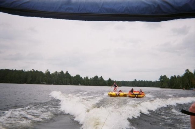 Saranac Lake, Upstate New York 2010 #you already know Im the idiot standing up on the tube  #the guy driving the boat made it his mission to try and make everyone fall off the tube at least once the week we were there  #I gave a kid a concussion with my head that week because our tubes slammed together #mine #those tubes were going at least 30 miles an hour #kodak