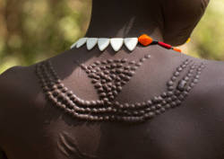 mvtionl3ss:  Sudanese Toposa tribe woman refugee with scarifications on her body, Omo Valley, Kangate, Ethiopia.Photo by Eric Lafforgue