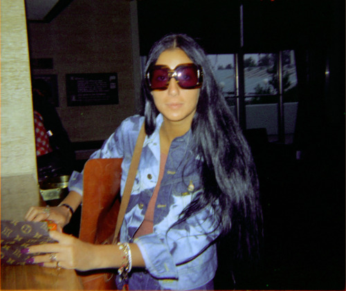 gimmebrain:rare picture of cher with her louis vuitton wallet in 1971, she literally invented LV.