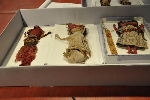 Visiting conservation scholar Anna Keruzec is creating trays for three-dimensional Pre-Columbian dolls.
She begins by laying the dolls on a tray-sized piece of paper and tracing them. Then, she cuts out tray-sized sheets of thin Ethafoam and a...