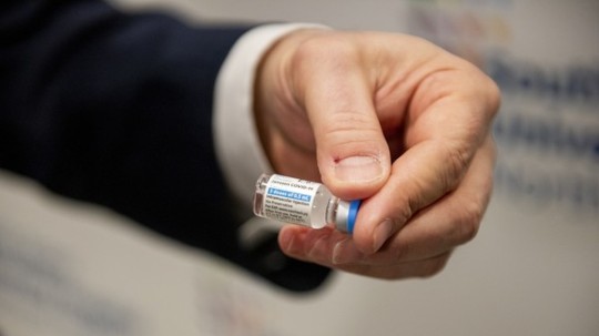 A healthcare worker holds a vial of the Johnson & Johnson Janssen Covid-19 vaccine at Northwell Health South Shore University Hospital in Bay Shore, New York, U.S., on Wednesday.
