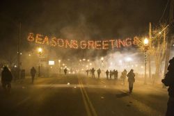 therealbenyonce:  north-kane:  &ldquo;Seasons Greetings&rdquo; This photo was taken earlier tonight by a protestor in Ferguson, MO. The Irony.   this is going to be one of those pictures that lasts forever 