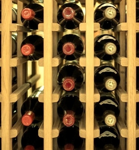 Example Of A Mid-sized Cottage Wine Cellar Design With Storage RacksAn Illustration Of A Medium-sized