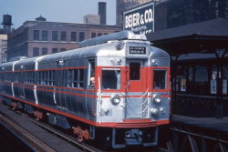 marmarinou:  Caption: “A then-new CTA 5000-series car at  Halsted on the old ‘Met’ L, 1947. The four 5000-series cars wore this  unique paint scheme until 1955 when they were repainted into the  standard CTA green and cream colors of the time.”