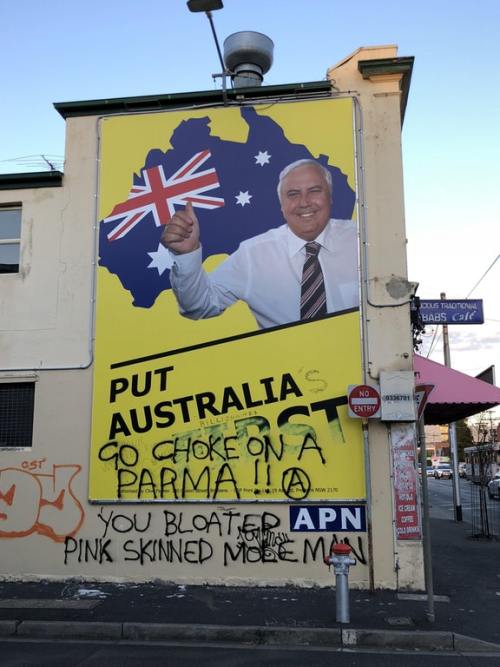 Vandalised billboard in Melbourne promoting right-wing politician and mining magnate, Clive Palmer.T