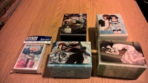 My amiami order + card order arrived. 2 Playmats, 4 deck boxes, Zerachiel sleeves for V-Angel F