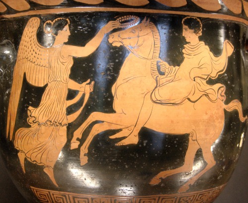 lionofchaeronea:Nike (Victory) crowns a horse and rider.  Side A of an Apulian red-figure bell-krate