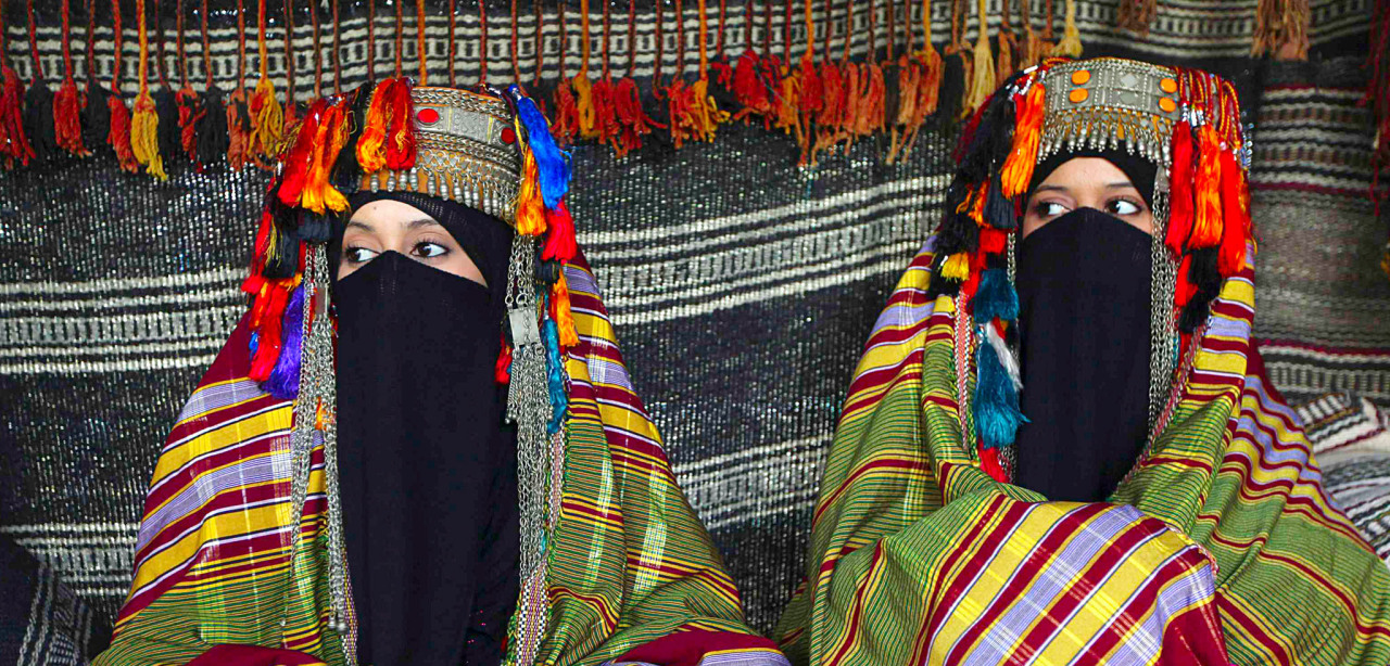 kaafla:  Bedouin women wear traditional costumes as they sit in their tent during