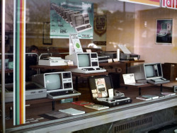 historylover1230:  Front window of a computer store in West Germany, 1984    Radio Shack!  I wanted all of them when I got my first computer in 1983.  Check out the portable (I think it&rsquo;s a model 100)