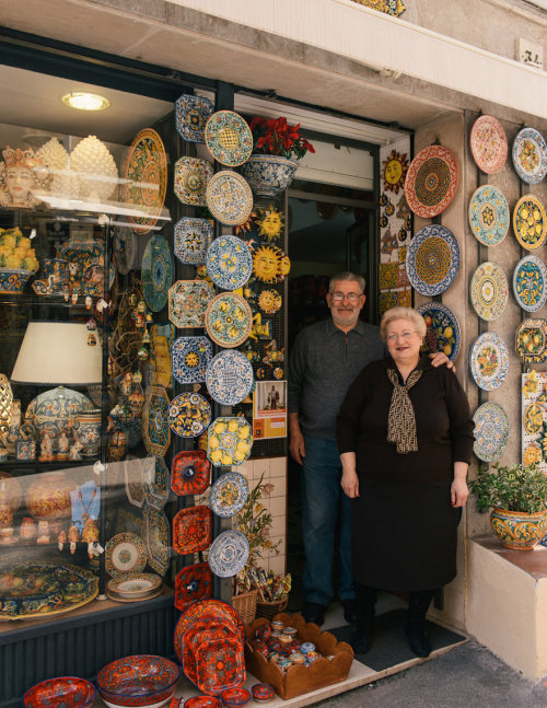 Sicilian ceramics and shop owners in Taormina.