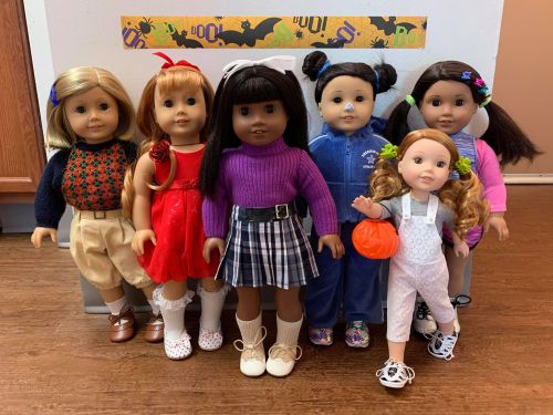 A Very Merry American Girl Halloween. Some of the dolls are wearing the same costumes from last year