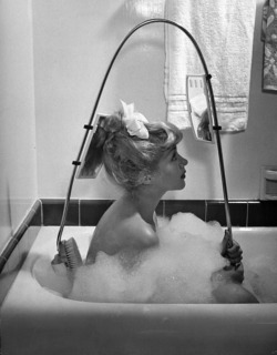 timeofbeauty:  Allan Grant - New back brush lets bather see just what she is up to, 1947. 