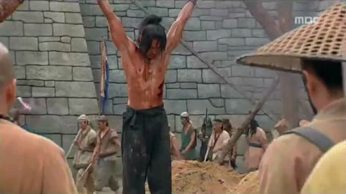 Gyebaek E10 part 2 of 2 In this Korean historical drama, a muscular young man is publicly flogged an