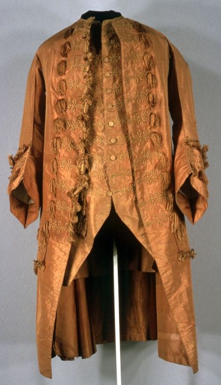 thegentlemanscloset:Coat, English, 1701-1750. Flame-colored taffeta, trimmed with cording and tassel