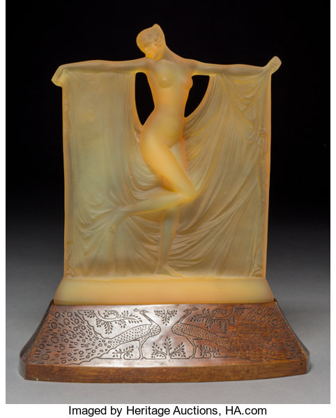 the1920sinpictures:1925 c. Rene Lalique amber glass “Suzanne” statuette on a bronze peacock-decorate