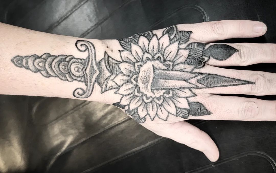 Andy Howl - Sunflower and dagger. #blackwork #andyhowl...