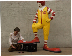 banksystreetart:  New by Banksy: A fibreglass replica of Ronald McDonald having his shoes shined by a real live boy. The sculpture will visit the sidewalk outside a different McDonalds every lunchtime for the next week!