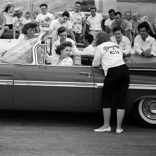 At the drag strip with the Dragettes and their 1959 Chevrolet Impala Convertible.