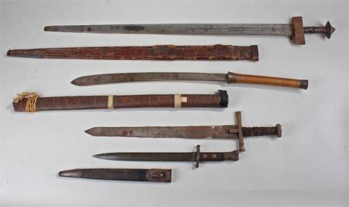 Various Edged WeaponsFrom top to bottom: Tuareg Takouba, Southeast Asian Dha, Sudanese kaskara, Brit