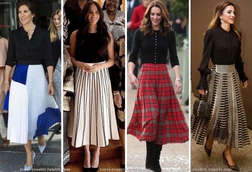 royal ladies in black tops and midi skirts