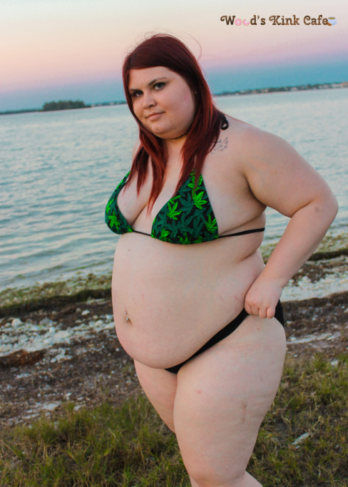 woodsgotweird:  “High by the Beach” photosetWood sensually teases and strips down to her bikini in front of the sunset. Featuring views of her flabby body and tits falling out of her weed-print bikini top. Don’t you want to get high by the beach