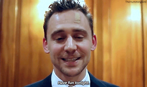 A somewhat tipsy Tom Hiddleston thanks Richard E. Grant for collecting Tom’s ‘Elle Man of the Year’ 
