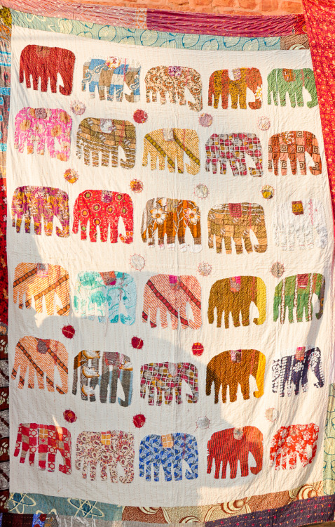 Hand-made elephant pattern quilt in Thamel, Kathmandu, Nepal.  I wanted to buy it so bad. :’( (re-up