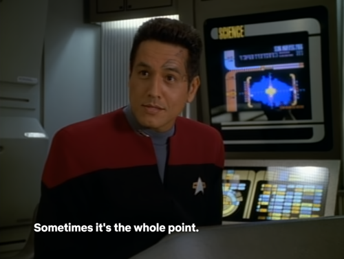 A Conversation On The Bridge Between Janeway, Tom, Chakotay And Tuvok. Tuvok Makes A Comment About Human