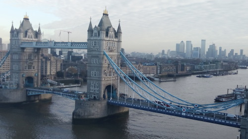 Tower Bridge London, as seen from City Hall. With the new financial district in docklands in the dis