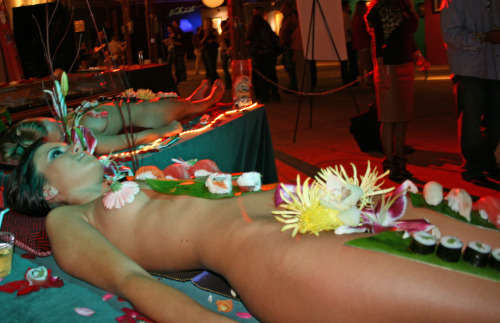 nyotaimori. aka softcore food porn. but the last one is of cookies and shit. lol.