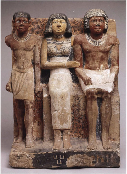 Statue of Seked-kaw, His Wife, and Their SonThe charm of this pretty, rather simple statue is owed t