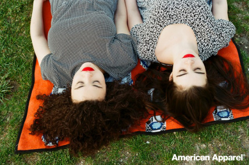 americanapparel:  Diana and Barbara wear the NDP Winie Print Rayon Babydoll Dress and NDP Pia Print T-Shirt Romper and NDP Simy Orange Print Throw. May 2014.
