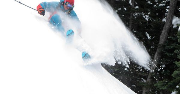 frshmag:  Big mountain pro skier Seth Morrison lays out a big turn in deep snow.