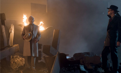 fuckyeahgoodomens: Aziraphale with wings on fire (that’s the bible on the statue burning) and Crowle