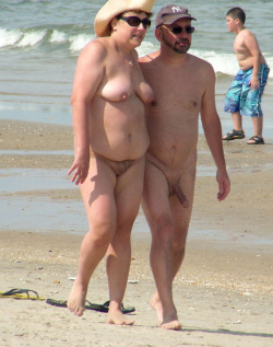 mixedgendernudity:  He got hard after this picture, he enjoyed the attention at the nude beach  She does not deserve him