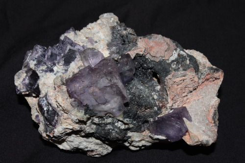 Fluorite from the Ojuela Mine, Mapimi, Mexico shown under long wave ultraviolet (black light) and wh