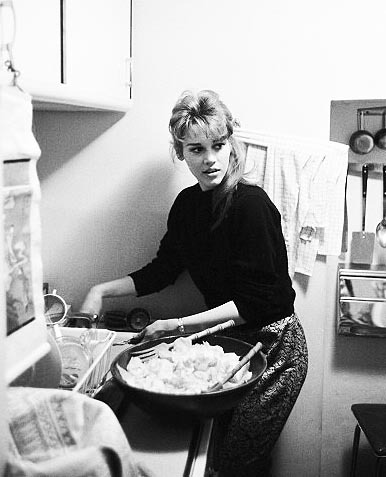 billowy: Jane Fonda cooking at home in her New York apartment, 1960