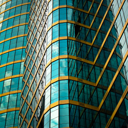 amadion:  Blue and Gold Windows Blue and gold coloured windows on a tower block in Kuala Lumpur. Near the Dang Wangi LRT station i think. Photographer: Nick Depree