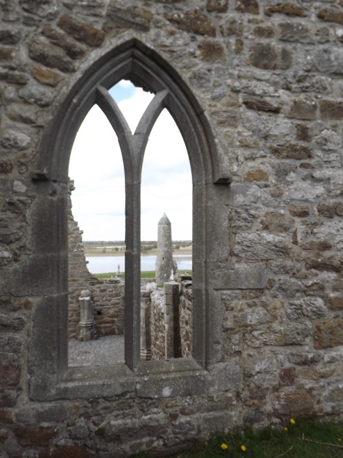 Gothic Arch Window in Stone Wall Looking toward McCarthy’s Round Tower and River Shannon, Clonmacnoi