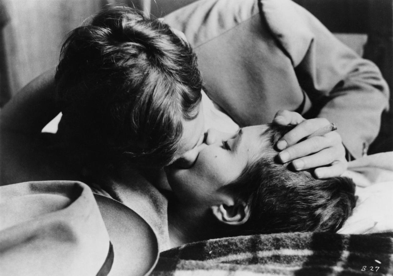 Jean Paul Belmondo as Michel Poiccard in a love scene from Breathless directed by