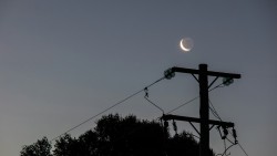 tcr55:  Crescent moon, pole and wires at Mystery Bay