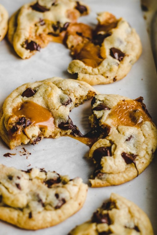 sweetoothgirl:Caramel Stuffed Chocolate Chip Cookies